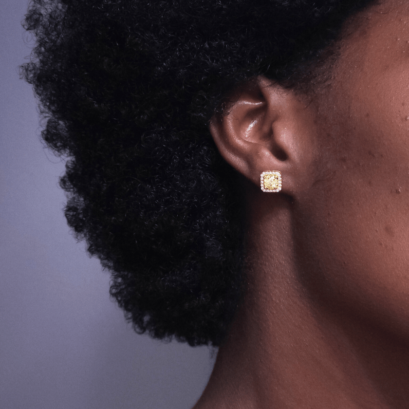 girl wearing square shaped golden yellow colored moissanite stud earrings