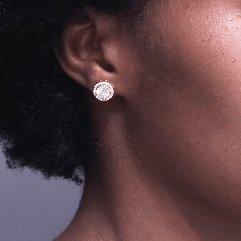 girl wearing sparkling 14 karat gold moissanite stud earring