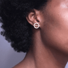 girl wearing 14 karat gold plated sterling silver earrings featuring a gold bar across the middle