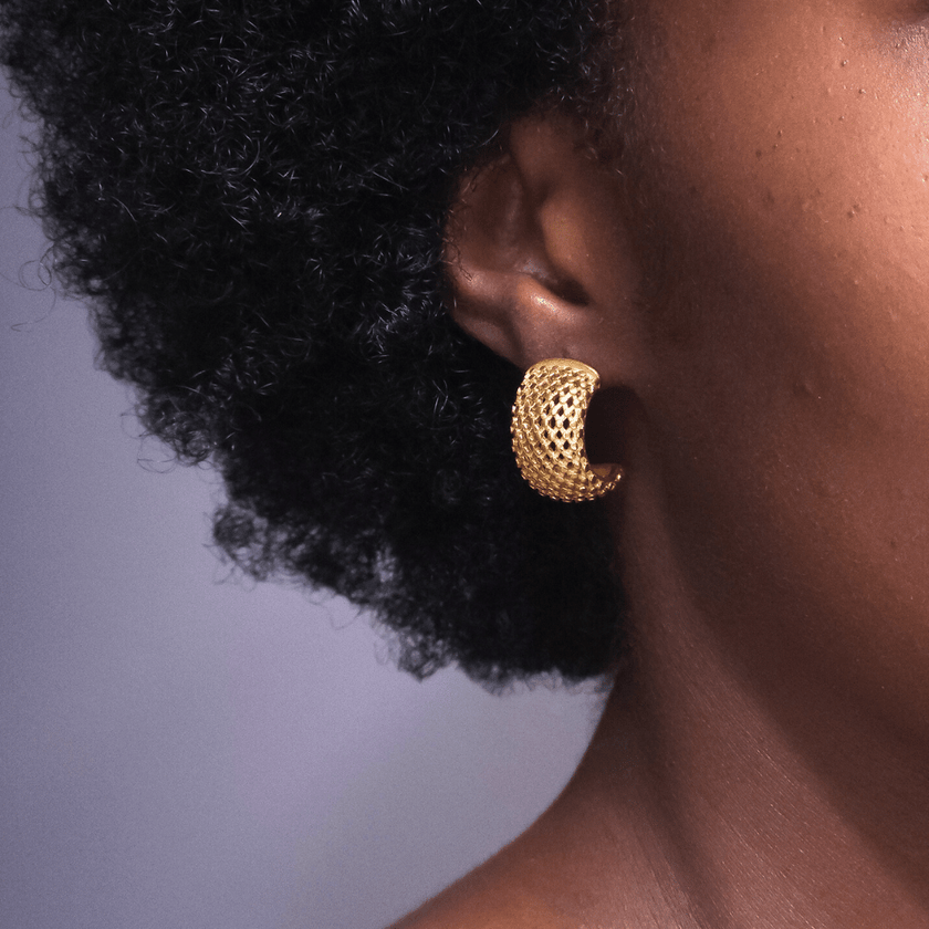 girl wearing 18 karat gold plated stainless steel mesh earrings
