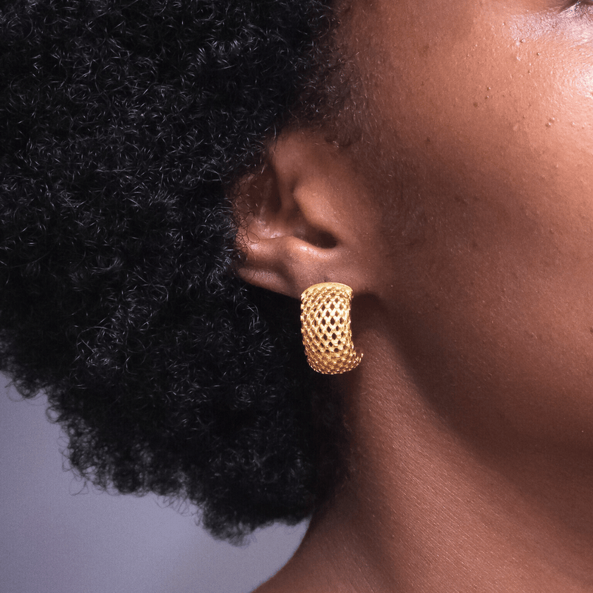 close up of girl wearing 18 karat gold plated stainless steel mesh earrings