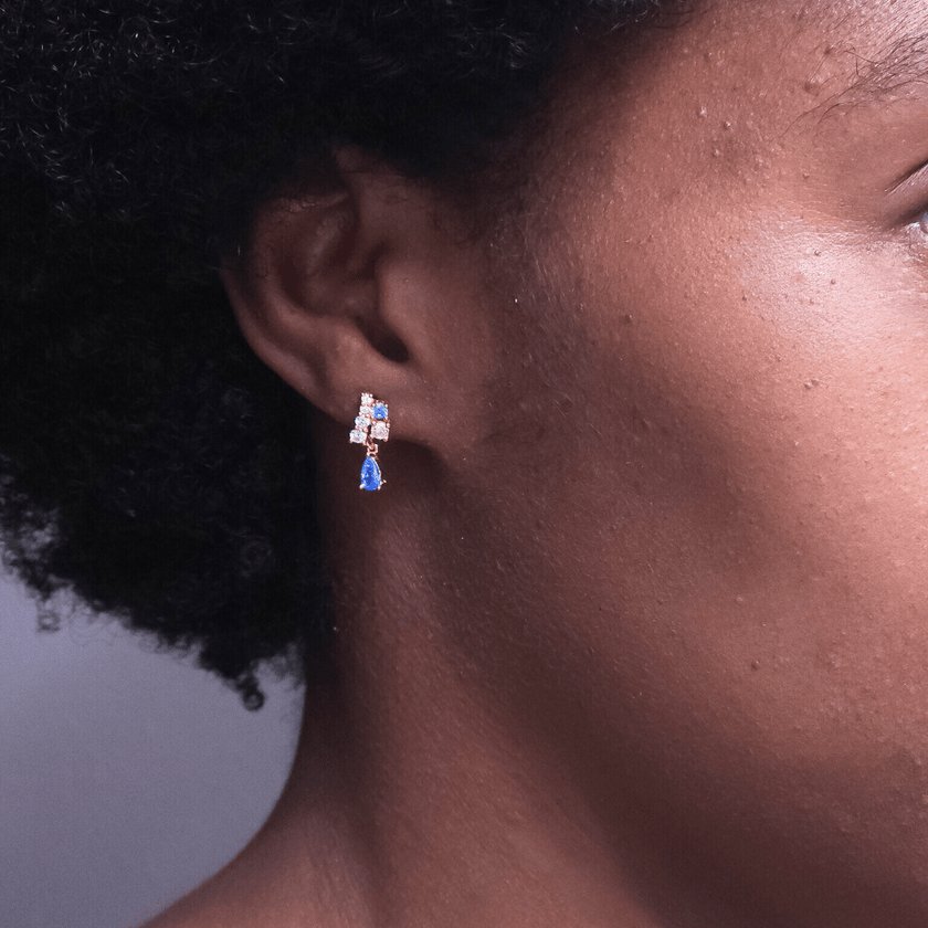 girl wearing pink and blue crystal dangle earrings benefitting the jack and jill of America foundation