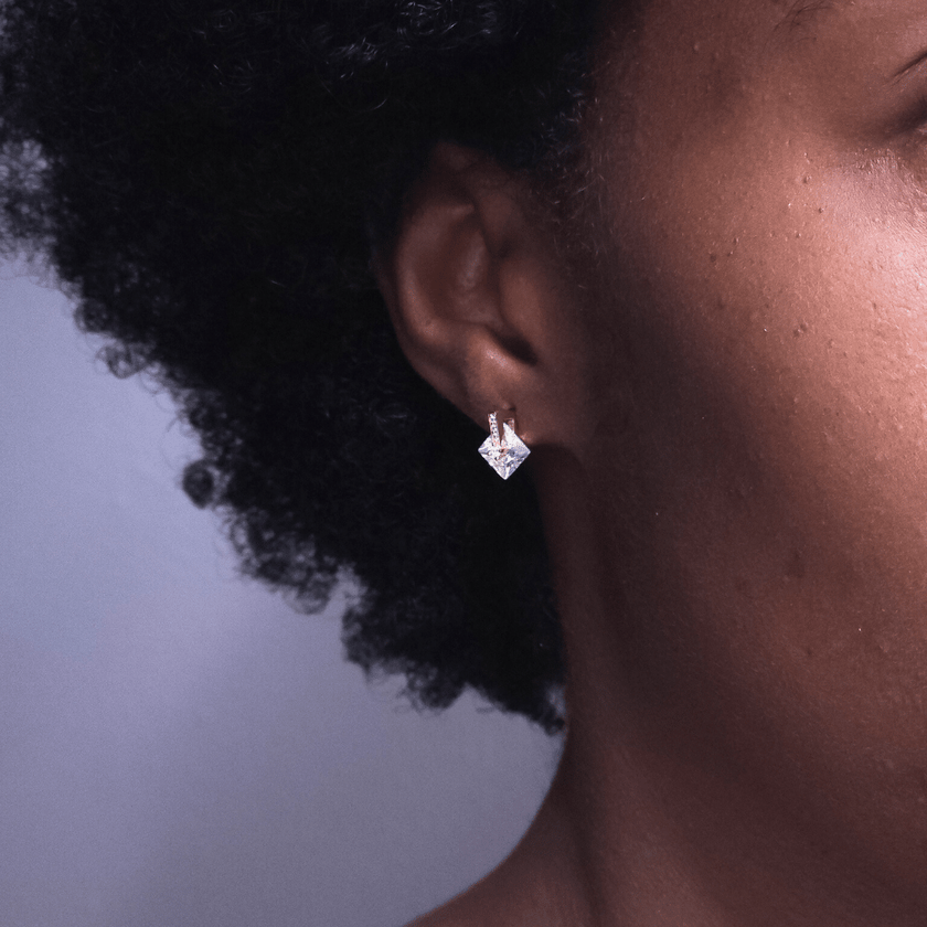 girl wearing unique 14 karat gold plated water resistant waterproof 14 karat gold plated sterling silver stud earrings