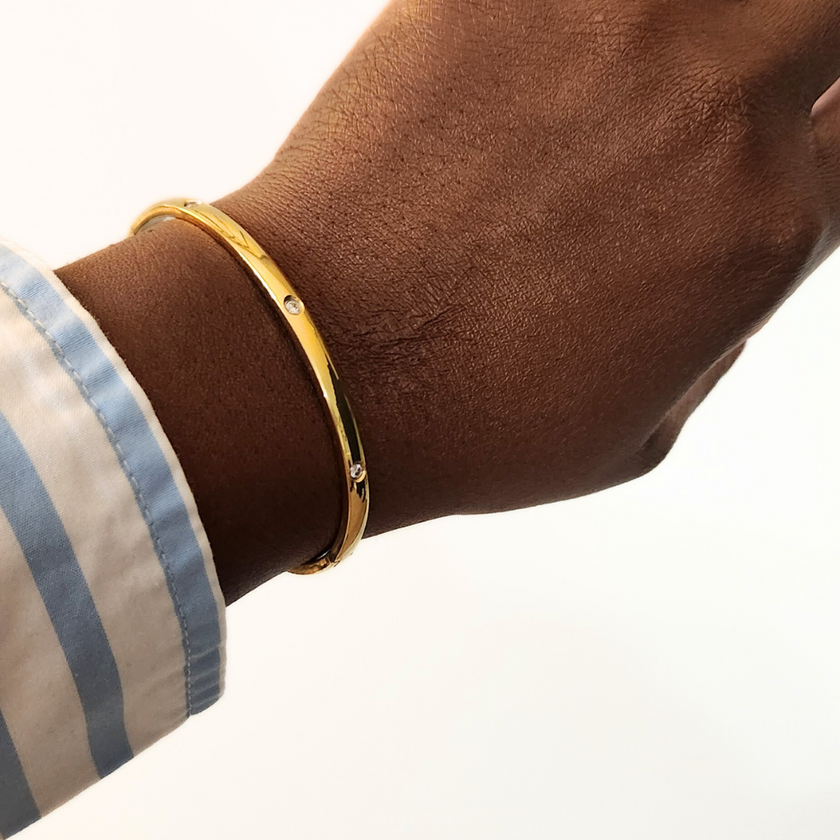 Close up of Woman wearing the Smooth Edge Stone Studded Hinge Bracelet