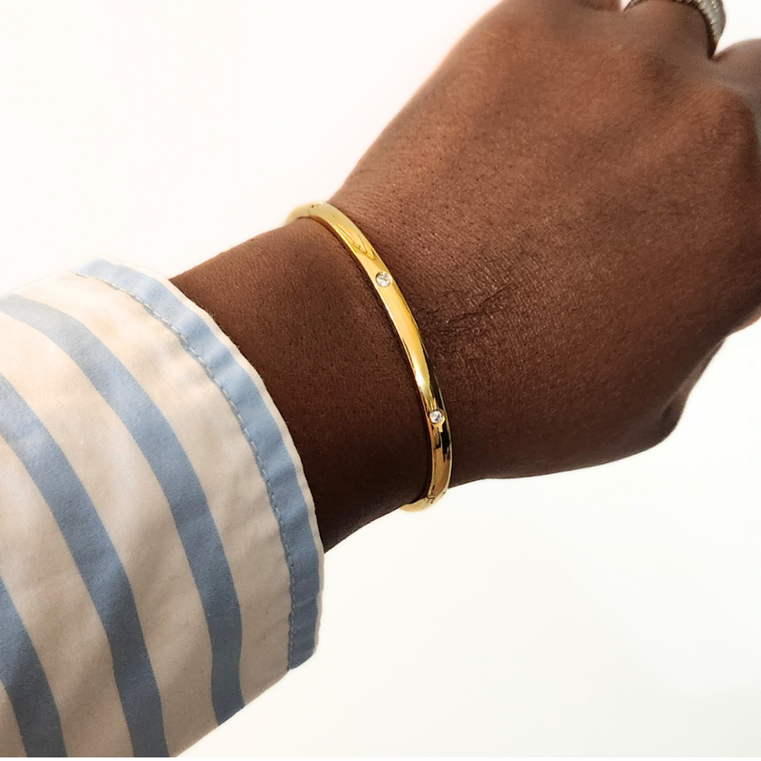 Woman wearing the Smooth Edge Stone Studded Hinge Bracelet