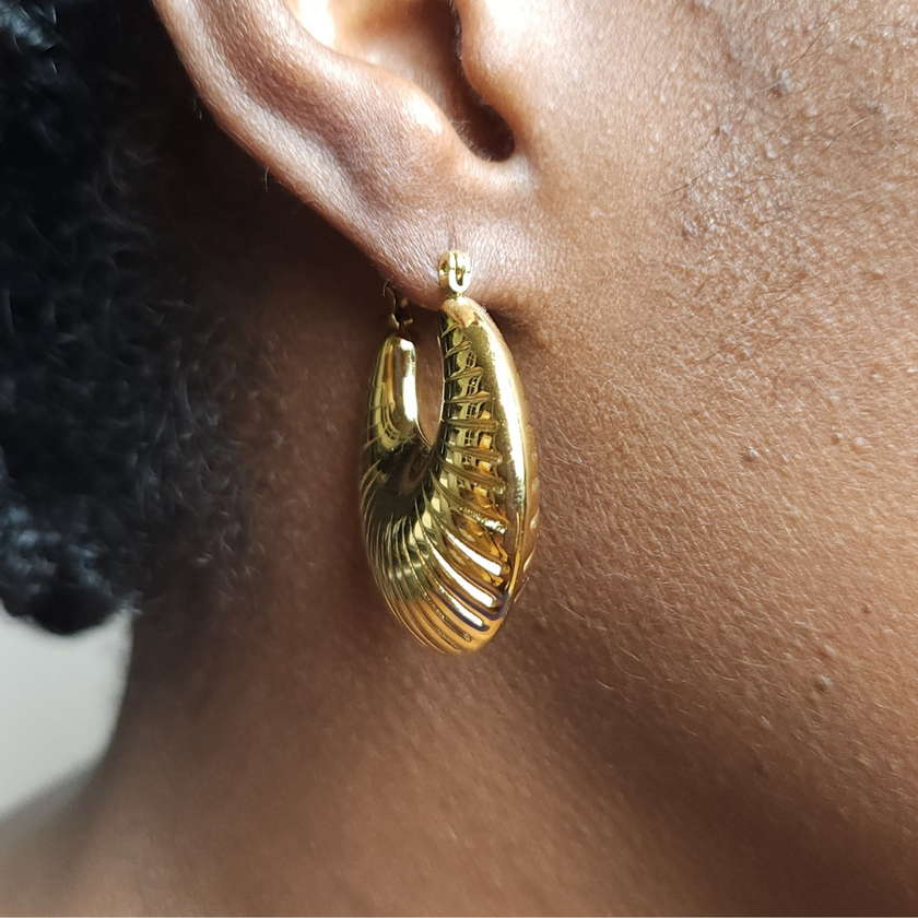 Close up of woman wearing of Twenty-Eight Minna Textured Chucky Hoops