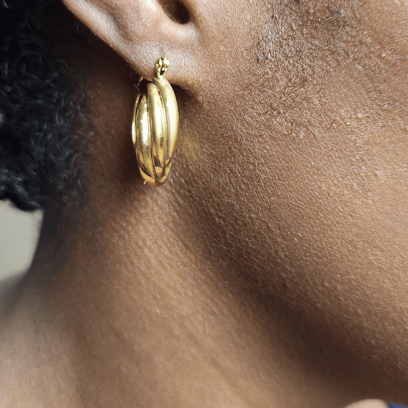 Close up of woman wearing Twenty-Eight Minna Twisted Chunky Hoops